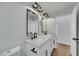 Bathroom featuring double sinks, modern fixtures and a toilet at 6664 Rutgers Dr, Las Vegas, NV 89156