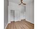 Bedroom featuring wood floors, ceiling fan, and a large closet at 6664 Rutgers Dr, Las Vegas, NV 89156