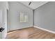 Bright bedroom featuring wood-look flooring and a vaulted ceiling at 6664 Rutgers Dr, Las Vegas, NV 89156