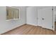 Bedroom featuring wood-look laminate floors, a window and a closet at 6664 Rutgers Dr, Las Vegas, NV 89156