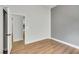 Bedroom featuring gray accent wall, wood-look laminate floors and a closet at 6664 Rutgers Dr, Las Vegas, NV 89156