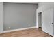 Relaxing bedroom with wood-look flooring, closet access and neutral color palette at 6664 Rutgers Dr, Las Vegas, NV 89156