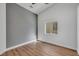 This bedroom features gray walls, a window and wood floors at 6664 Rutgers Dr, Las Vegas, NV 89156