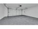 Spacious garage with epoxy flooring, offering durability and a clean look at 6664 Rutgers Dr, Las Vegas, NV 89156