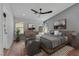 Comfortable main bedroom with natural light, modern ceiling fan, and stylish decor at 6664 Rutgers Dr, Las Vegas, NV 89156