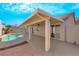 Home featuring covered patio and backyard pool at 6664 Rutgers Dr, Las Vegas, NV 89156