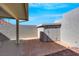 Outdoor patio area featuring tiled flooring, a storage shed, and partial coverage from the elements at 6664 Rutgers Dr, Las Vegas, NV 89156