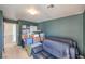 Bedroom filled with storage boxes and furniture, illuminated by a ceiling light at 6687 Higger Tor Ave, Las Vegas, NV 89139