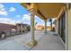 Outdoor kitchen and barbecue area with stone accents, covered patio, and decorative columns at 6760 Hinson St, Las Vegas, NV 89118