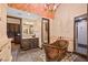 Unique bathroom features a copper soaking tub, separate vanities, and a tiled walk-in shower at 6760 Hinson St, Las Vegas, NV 89118