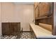 Stylish bathroom featuring ample counter space, decorative tile, and dark wood cabinets at 6760 Hinson St, Las Vegas, NV 89118