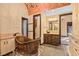 Unique bathroom features a copper soaking tub, separate vanities, and a tiled walk-in shower at 6760 Hinson St, Las Vegas, NV 89118