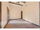 Bedroom with vaulted ceiling, wood beams, and decorative rug at 6760 Hinson St, Las Vegas, NV 89118