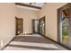 Bedroom featuring rustic wood trim and doors leading to outdoor areas at 6760 Hinson St, Las Vegas, NV 89118