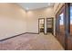 Bedroom with wooden doors and trim, and a view of a bathroom at 6760 Hinson St, Las Vegas, NV 89118