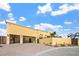 Exterior view of a home with a brick driveway and a three car garage at 6760 Hinson St, Las Vegas, NV 89118