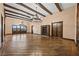 Spacious living room featuring beamed ceilings, dark hardwood floors, and custom built-ins at 6760 Hinson St, Las Vegas, NV 89118