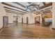 Expansive living room featuring beamed ceilings, dark hardwood floors, and direct kitchen access at 6760 Hinson St, Las Vegas, NV 89118