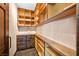 Walk-in pantry with custom built-in shelving and drawers for optimal storage at 6760 Hinson St, Las Vegas, NV 89118