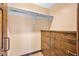 Walk-in closet featuring custom wood drawers and shelving, maximizing space for organized storage at 6760 Hinson St, Las Vegas, NV 89118