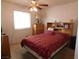 Cozy bedroom with carpet, ceiling fan and a comfy bed at 710 Strawberry Pl, Henderson, NV 89002