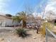 A charming single-story home with low maintenance landscaping and a fenced yard at 710 Strawberry Pl, Henderson, NV 89002