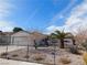 A charming single-story home with low maintenance landscaping and an attached garage at 710 Strawberry Pl, Henderson, NV 89002