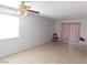 Light and bright living room with tile flooring, ceiling fan and large window at 710 Strawberry Pl, Henderson, NV 89002