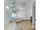 Serene bathroom featuring separate shower and tub, with stylish tile flooring at 7180 Grace Estate Ave, Las Vegas, NV 89113