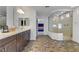 Stylish bathroom boasts a dual vanity, glass-enclosed shower, and neutral color palette at 7180 Grace Estate Ave, Las Vegas, NV 89113