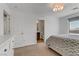 Bright bedroom with neutral carpet and a view to the en suite bathroom at 7180 Grace Estate Ave, Las Vegas, NV 89113