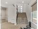 Hallway with staircase, stair gates, and natural light offers Gathering safety and style at 7180 Grace Estate Ave, Las Vegas, NV 89113