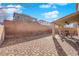 Spacious backyard with a covered patio and brick pavers, great for outdoor gatherings at 7707 W Diablo Dr, Las Vegas, NV 89113