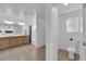 Bathroom with double sink vanity, tiled floor, shower and toilet at 7707 W Diablo Dr, Las Vegas, NV 89113