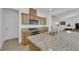 Well-equipped kitchen featuring granite countertops, stainless steel appliances, a cooktop, and ample cabinetry at 7707 W Diablo Dr, Las Vegas, NV 89113