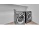 Modern laundry room with front-loading washer and dryer at 7707 W Diablo Dr, Las Vegas, NV 89113