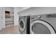 Modern laundry room with front-loading washer and dryer at 7707 W Diablo Dr, Las Vegas, NV 89113