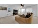 Bright and spacious living room with plush carpet, a ceiling fan, and neutral paint at 7707 W Diablo Dr, Las Vegas, NV 89113