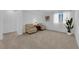 Cozy living room featuring neutral carpet, two armchairs, and a decorative plant at 7707 W Diablo Dr, Las Vegas, NV 89113