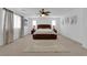 Bright main bedroom featuring a ceiling fan, wood furniture, carpet, and a neutral color palette at 7707 W Diablo Dr, Las Vegas, NV 89113