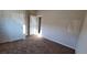 Clean and simple bedroom with neutral carpet, closet space, and a bright window at 7910 Shimmery St, North Las Vegas, NV 89084