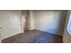 Cozy bedroom with neutral carpet, double closets, and ample natural light at 7910 Shimmery St, North Las Vegas, NV 89084