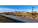 Community dog park with mountain views, surrounded by a secure fence and walking paths at 7910 Shimmery St, North Las Vegas, NV 89084