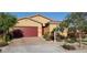 Beautiful single-story home with lush landscaping, paved driveway, and a welcoming entrance at 7910 Shimmery St, North Las Vegas, NV 89084