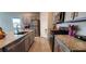 Modern kitchen featuring stainless steel appliances, granite countertops, and ample cabinet space at 7910 Shimmery St, North Las Vegas, NV 89084
