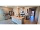 Spacious kitchen with a large island, stainless steel appliances, and plenty of counter space at 7910 Shimmery St, North Las Vegas, NV 89084