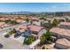 Aerial view of the neighborhood showcasing a two-story home with a red tile roof at 7917 Sally Irene Ct, Las Vegas, NV 89113