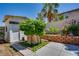 Backyard featuring a shed, trees, roses along the wall, and a concrete patio at 7917 Sally Irene Ct, Las Vegas, NV 89113