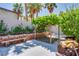 Backyard featuring a bench along the wall, a covered area, and space for outdoor enjoyment at 7917 Sally Irene Ct, Las Vegas, NV 89113