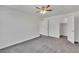 Bedroom featuring gray carpet, a ceiling fan, and a closet for storage at 7917 Sally Irene Ct, Las Vegas, NV 89113